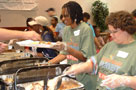 photo of volunteer serving food